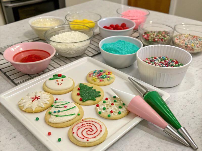 Decorating Crumbl-style cookies with frosting and sprinkles